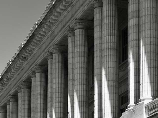 Classical columns of a courthouse, illustrative photo